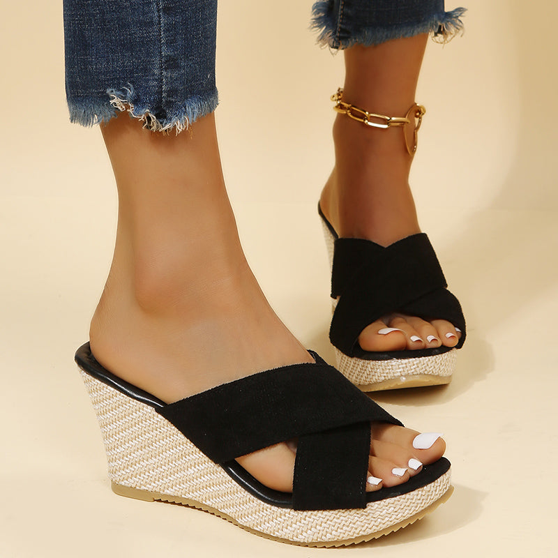 Women's stylish open-toe slip-on wedge sandals with cross straps, great for comfortable everyday summer wear.