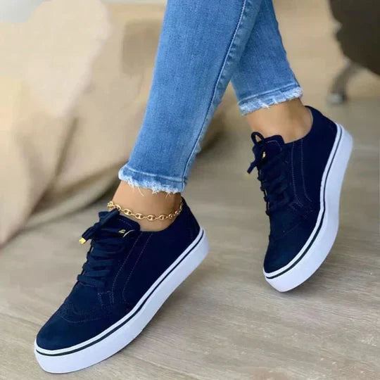 Comfortable women's lace-up walking shoes, featuring arch support and a stylish design for everyday wear.