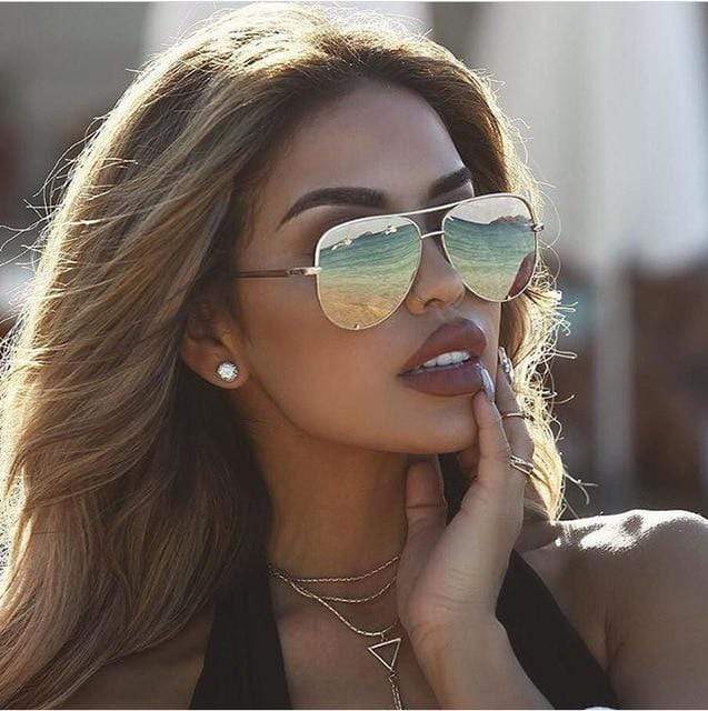 Trendy women's aviator sunglasses with silver frames and pink mirrored lenses, a chic fashion accessory.