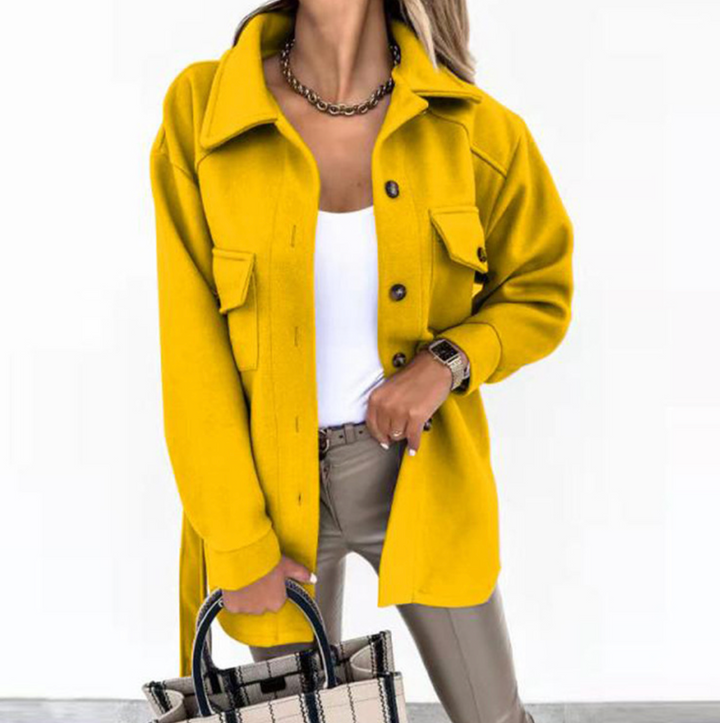 Stylish women's mid-season jacket with slim fit, zip closure, in spring shades enhancing a chic and modern silhouette.