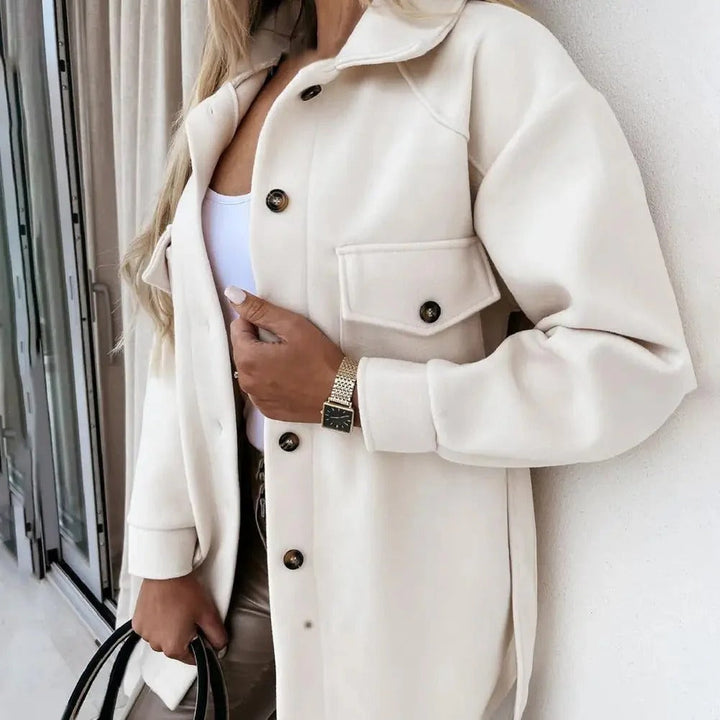Stylish women's mid-season jacket with slim fit, zip closure, in spring shades enhancing a chic and modern silhouette.