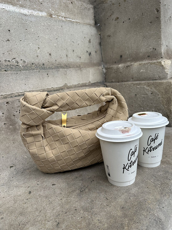 Chic women's compact suede bag, featuring beautiful hand-braiding.