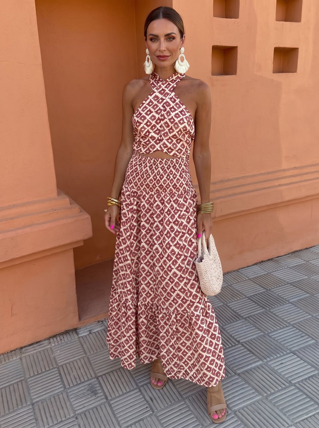 Chic women's off-shoulder ruffle top and high-waisted skirt matching set, ideal for elegant vacation wear.