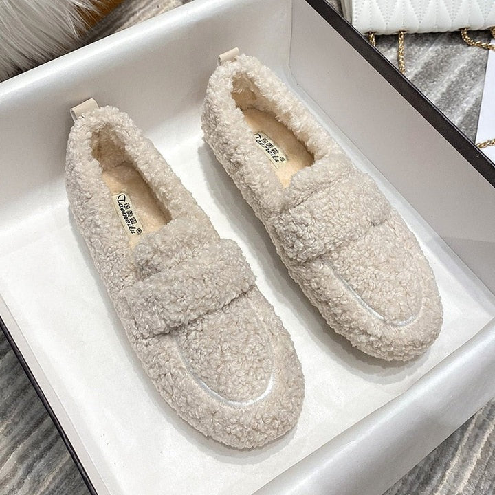 Soft, warm plush unisex house slippers with orthopedic support for cozy comfort and relaxation.