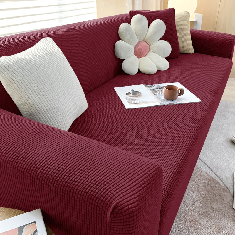 Textured stretch sofa cover in beige, snug fit for sofas, non-slip, adds elegance, protects against spills and wear.