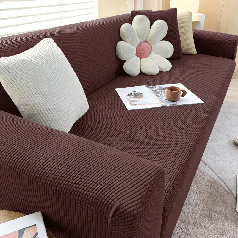 Textured stretch sofa cover in beige, snug fit for sofas, non-slip, adds elegance, protects against spills and wear.