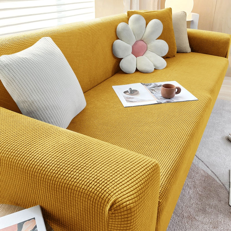 Textured stretch sofa cover in beige, snug fit for sofas, non-slip, adds elegance, protects against spills and wear.