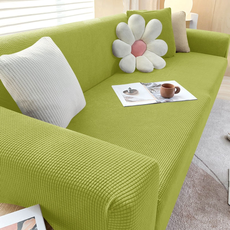 Textured stretch sofa cover in beige, snug fit for sofas, non-slip, adds elegance, protects against spills and wear.