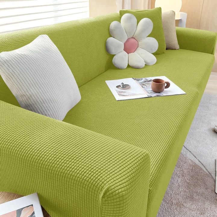 Textured stretch sofa cover in beige, snug fit for sofas, non-slip, adds elegance, protects against spills and wear.