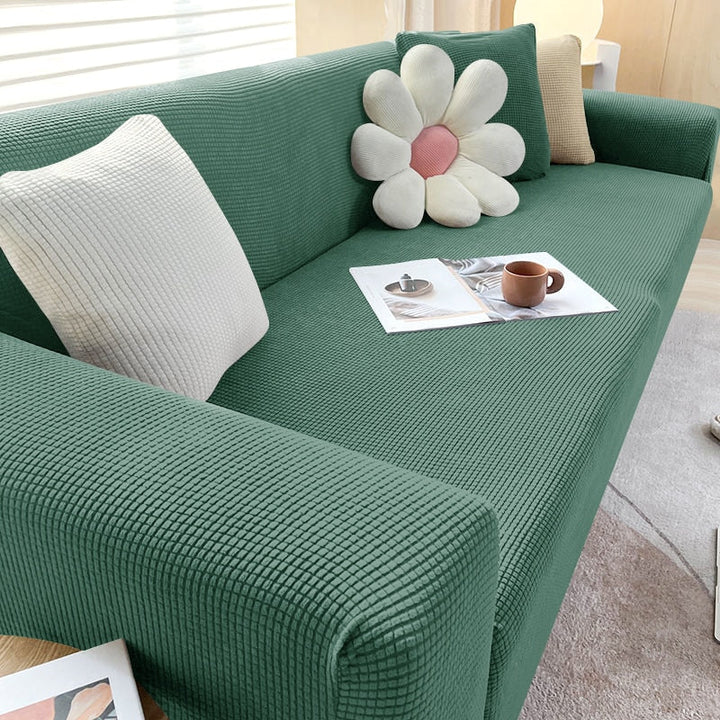 Textured stretch sofa cover in beige, snug fit for sofas, non-slip, adds elegance, protects against spills and wear.