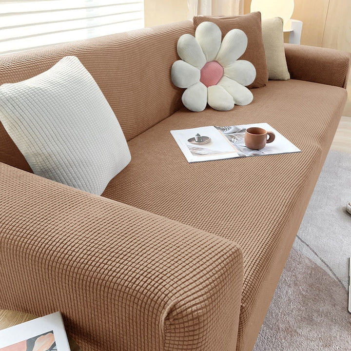 Textured stretch sofa cover in beige, snug fit for sofas, non-slip, adds elegance, protects against spills and wear.