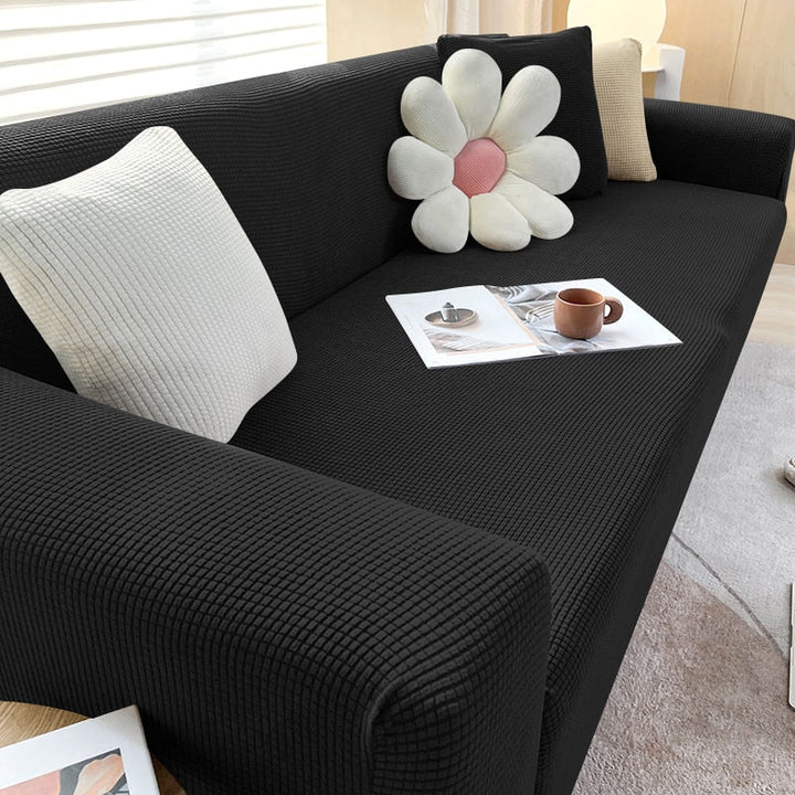 Textured stretch sofa cover in beige, snug fit for sofas, non-slip, adds elegance, protects against spills and wear.