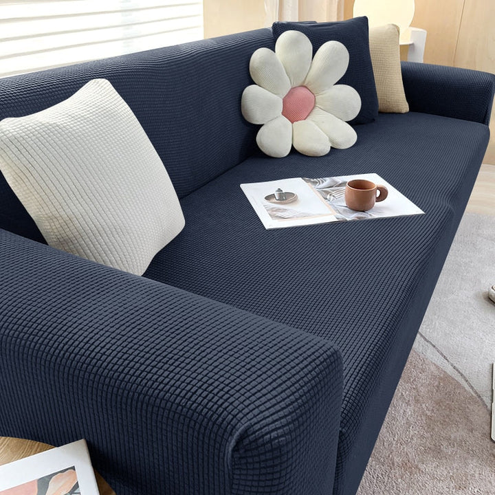 Textured stretch sofa cover in beige, snug fit for sofas, non-slip, adds elegance, protects against spills and wear.