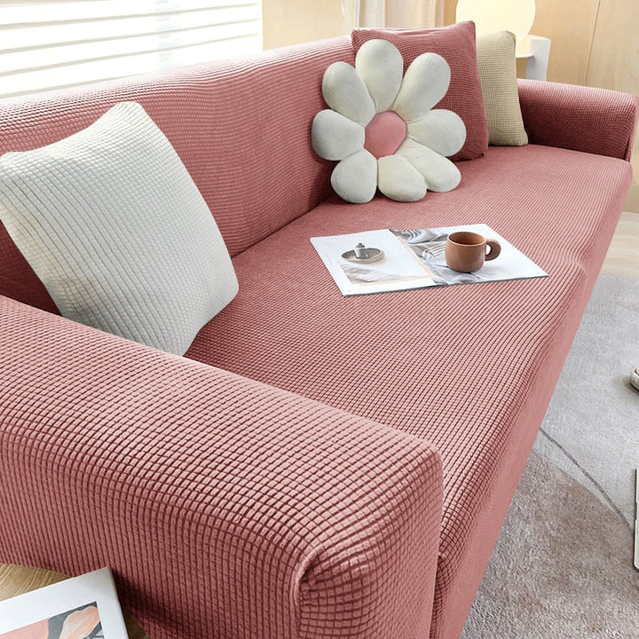"Textured stretch sofa cover in beige, snug fit for sofas, non-slip, adds elegance, protects against spills and wear."