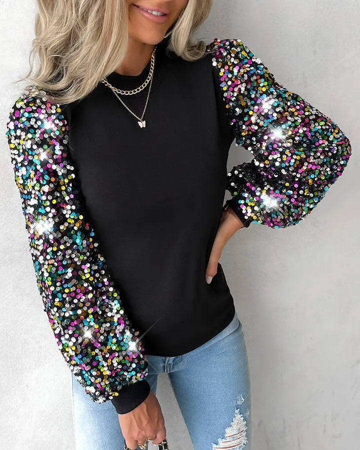 Versatile women's black balloon sleeve blouse, adorned with sequin details, suitable for office or casual styling.