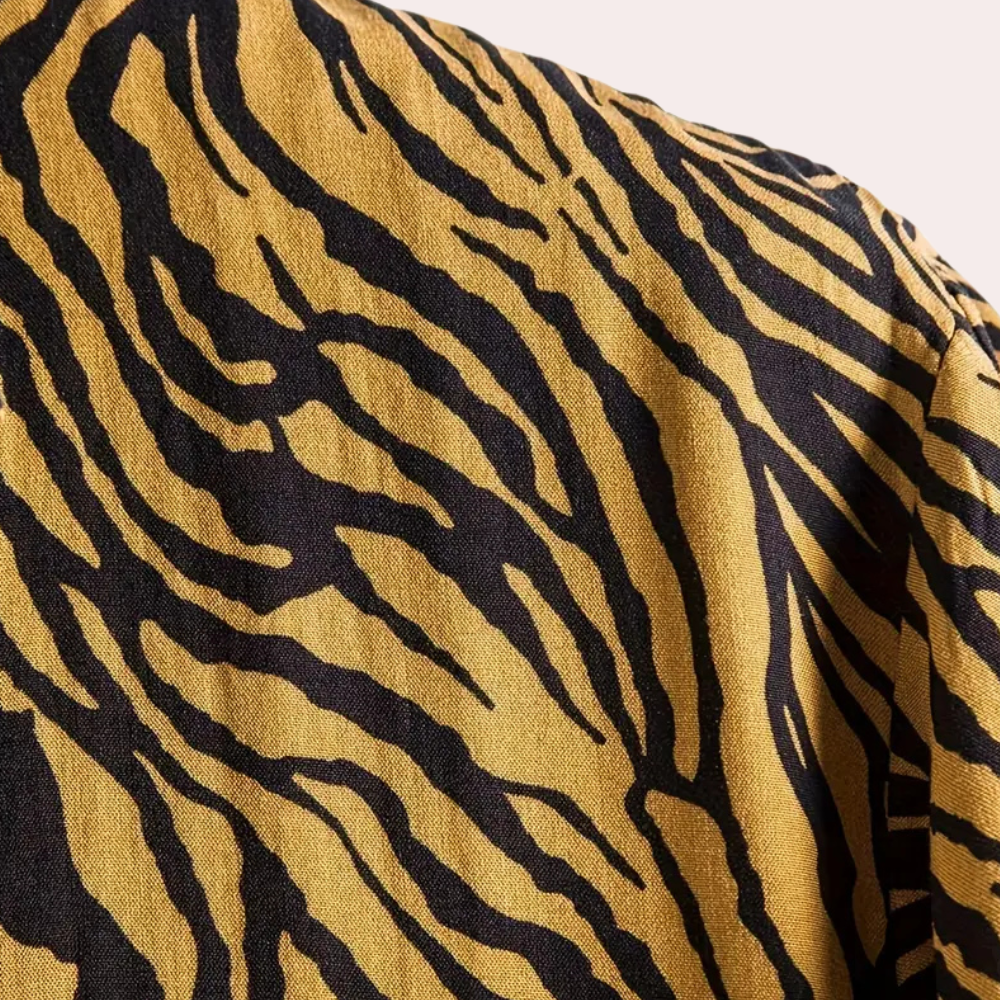 Stylish men's bold animal print shirt for summer vacations. Relaxed fit short sleeve, great for beach or resort.