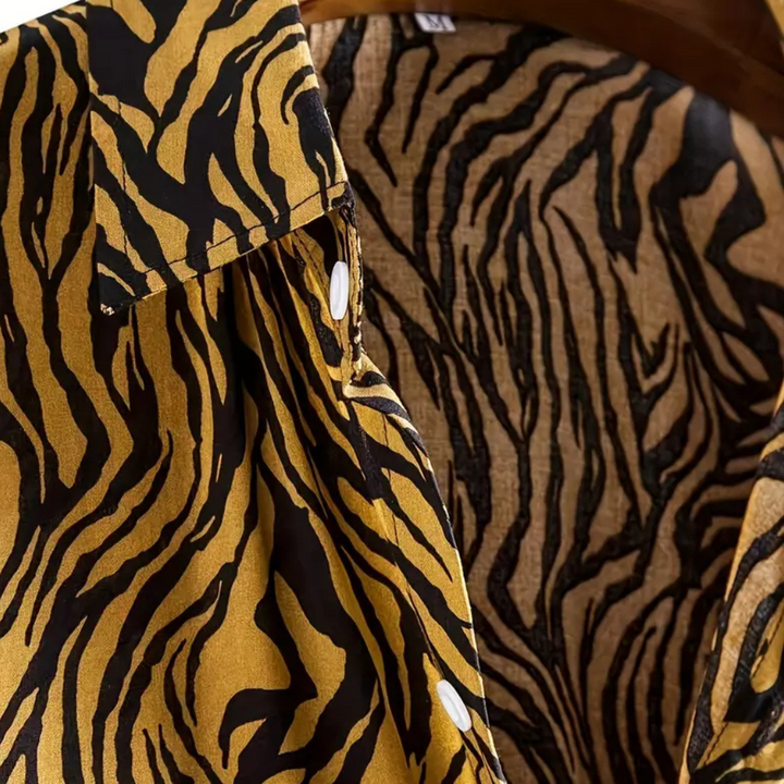 Men's casual short sleeve animal print shirt. Relaxed fit for comfortable summer fashion. Bold and stylish.
