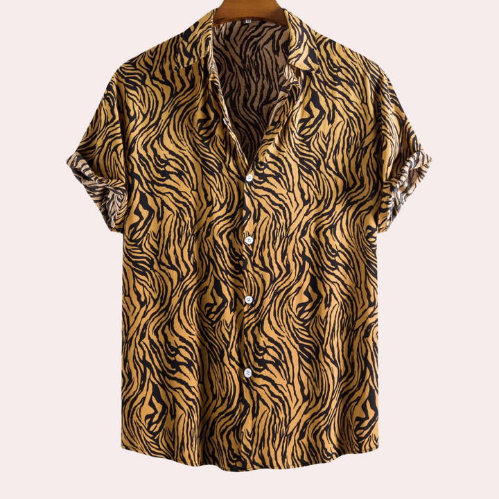 Men's relaxed fit short sleeve shirt with bold tiger print. Perfect for casual summer wear or vacation style.