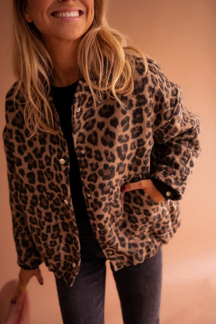 Trendy women's leopard print bomber jacket with snap front, perfect for a stylish casual look. Animal print fashion outerwear.