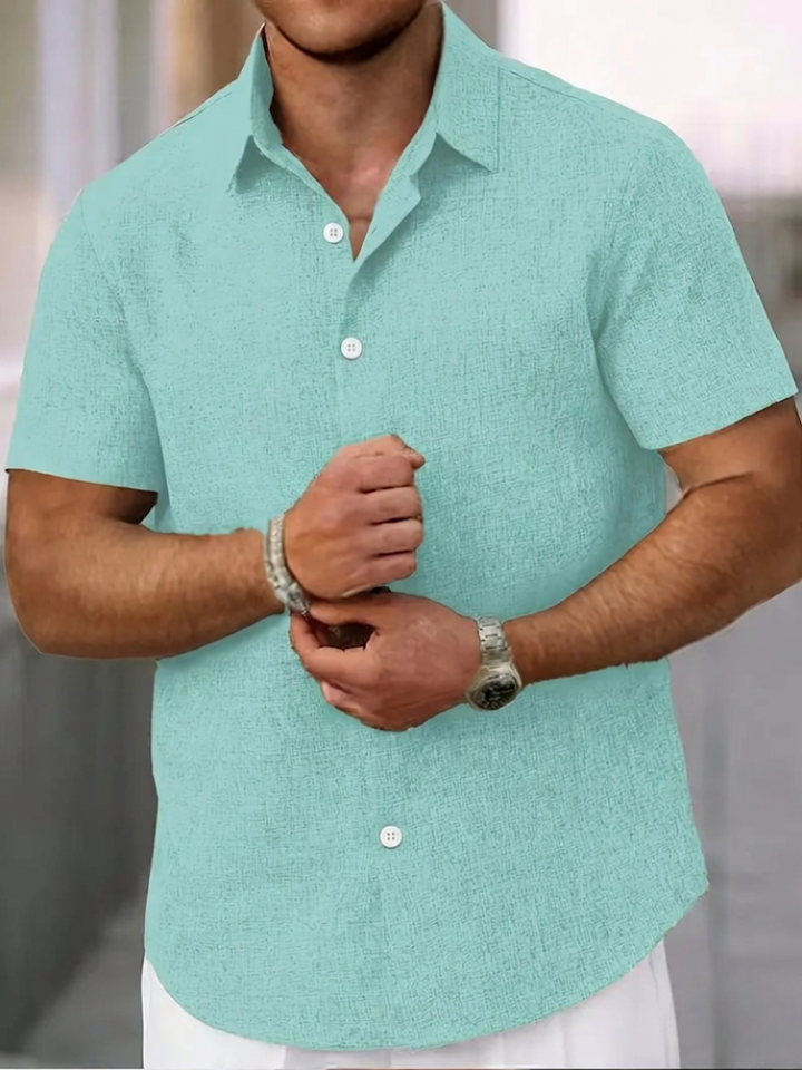 Men's relaxed fit button-down short sleeve shirt. Ideal casual wear, versatile & comfortable for summer.