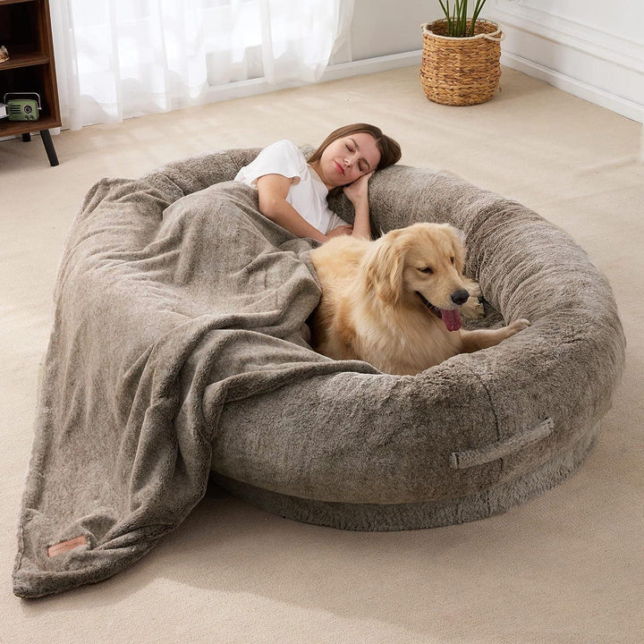 "Ultra-comfy plush lounger for pets and humans, oversized with plush pillow bolsters, dual-layer memory foam, stylish design.