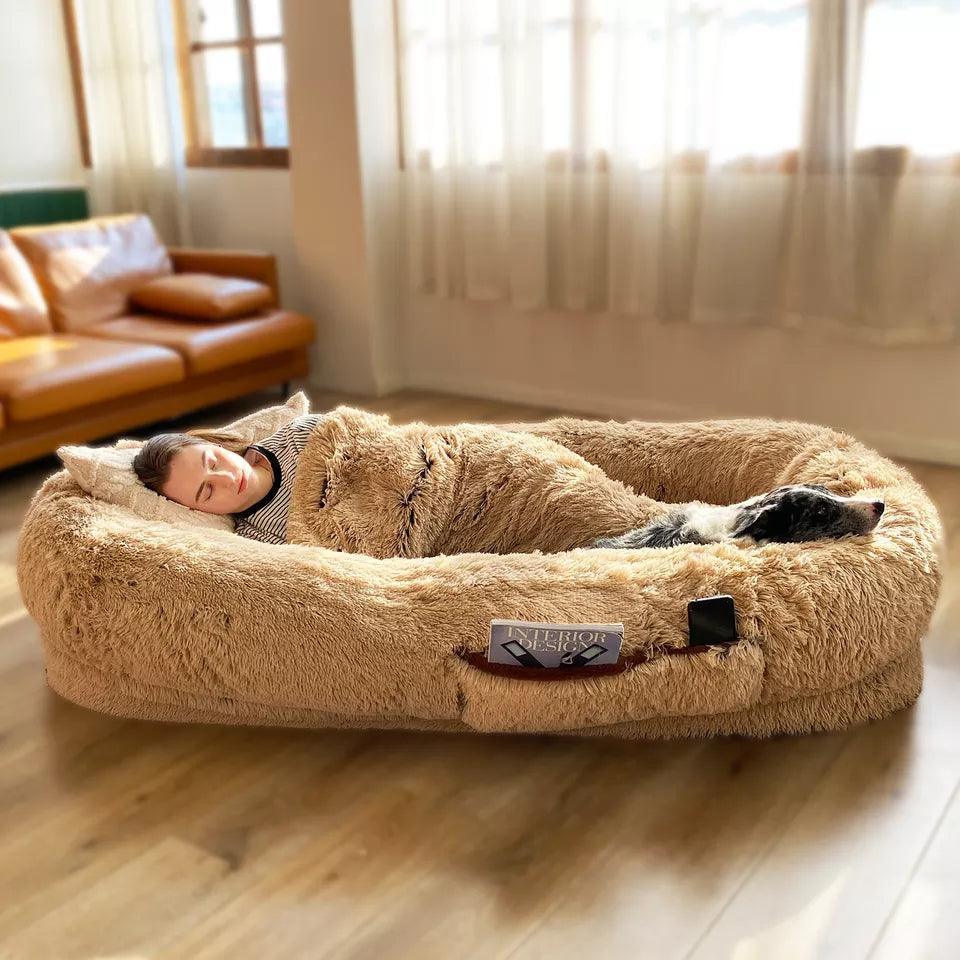 "Ultra-comfy plush lounger for pets and humans, oversized with plush pillow bolsters, dual-layer memory foam, stylish design.