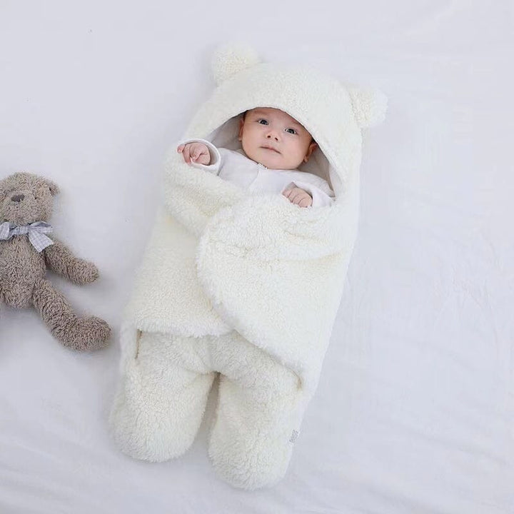 Infant bear ear quilted winter sleeping bag in ultra soft cotton. Cozy baby swaddle, perfect for cold nights.
