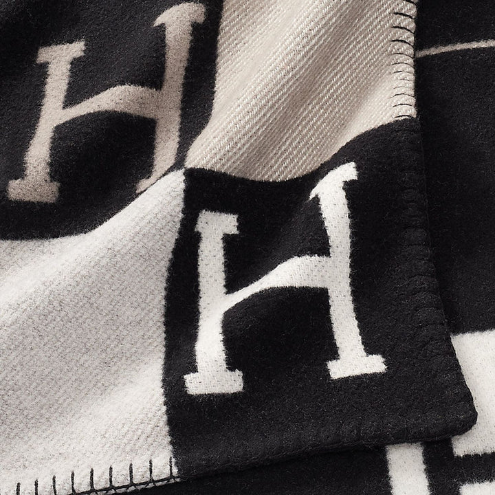 Elegant wool cashmere throw blanket, a perfect luxury addition to bedroom or living room decor.