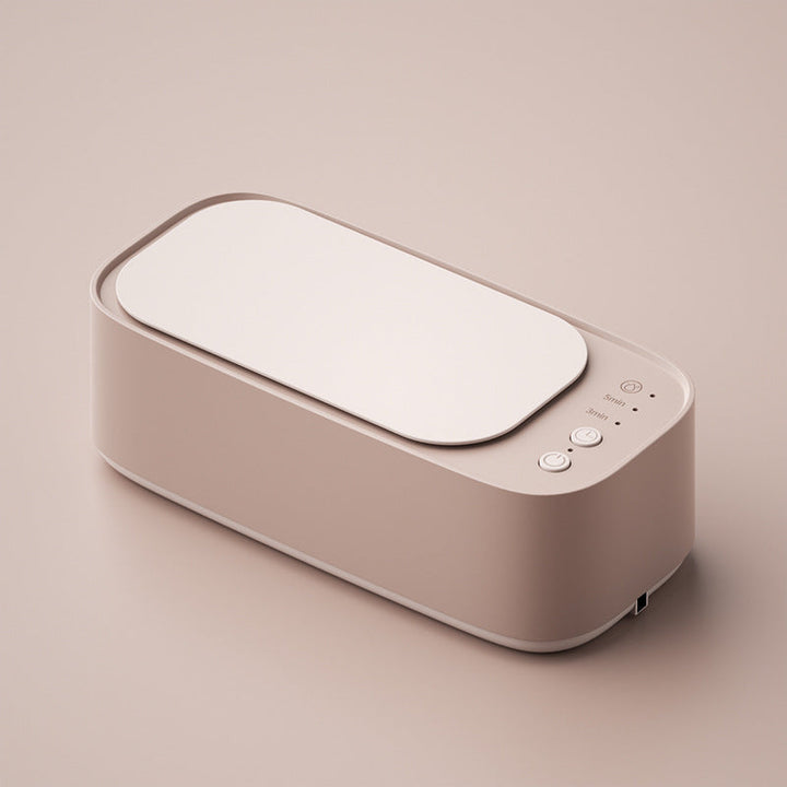 "Ultrasonic cleaning device restoring shine to jewellery, glasses, watches with advanced sound wave technology."