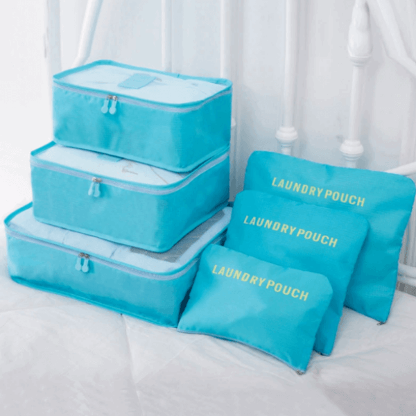 All 12 space-saving packing organizers displayed, showing various sizes for travel.