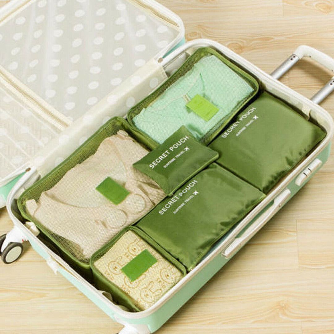 Overhead shot of 12 packing cubes, showing the full 2-set bundle for travel storage.