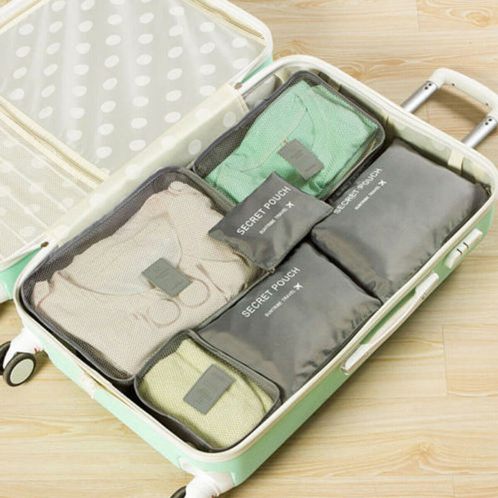 Durable & waterproof packing cubes for unisex travel, 12-piece storage bundle.