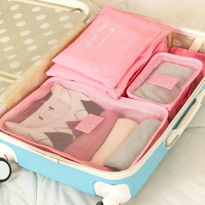 Travel essentials: 12 packing organizers, two 6-piece sets, space-saving bags.
