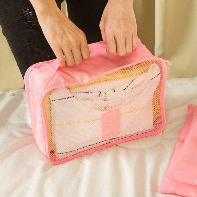 Waterproof travel organizers in use, neatly packed clothes within 2-set cube bundle.