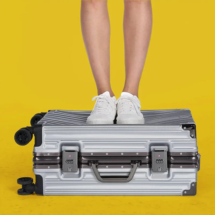 Black aluminum frame hard shell travel suitcase. Robust, secure, and smooth-rolling for any journey.