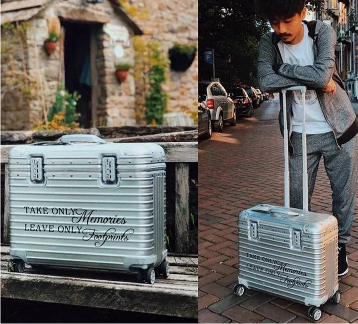 Sleek silver aluminum hardshell luggage, durable and secure for business or vacation travel.