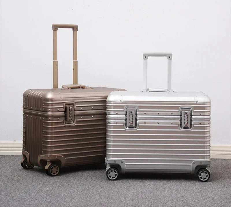 Elegant unisex aluminum luggage with a sturdy, extendable handle, perfect for secure travel.