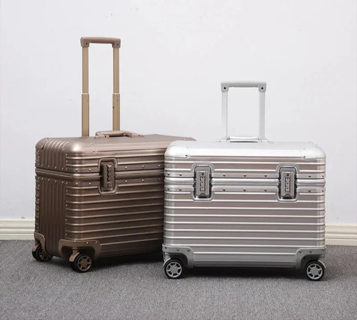 Elegant unisex aluminum luggage with a sturdy, extendable handle, perfect for secure travel.