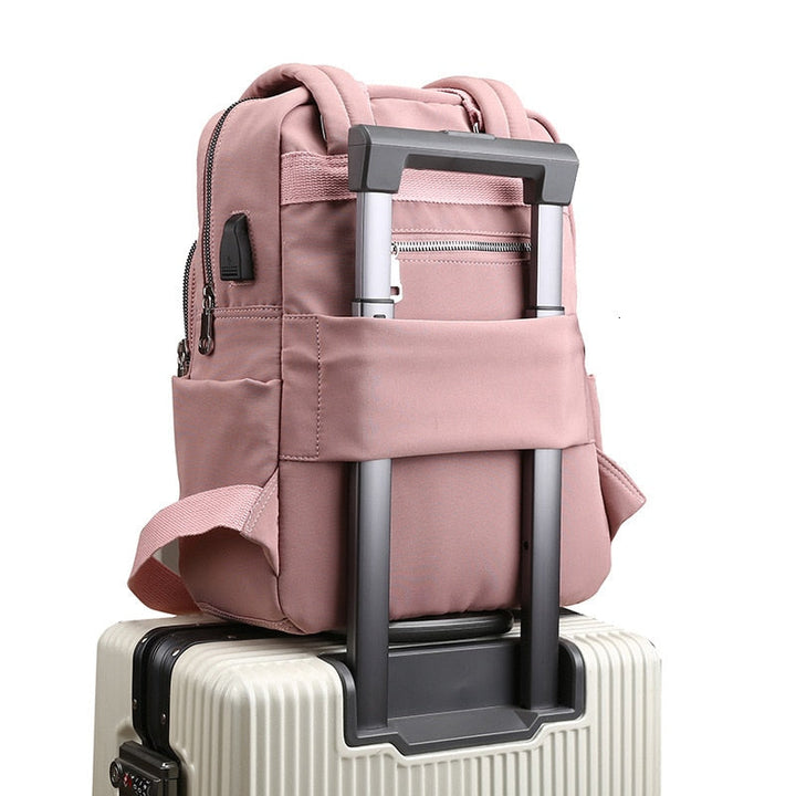 Unisex anti-theft backpack with USB charging port & multi-compartments, ideal for daily commute & travel.