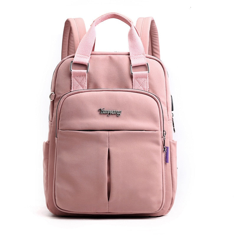 Padded laptop compartment inside a secure anti-theft backpack, fits up to 15.6-inch devices for work.