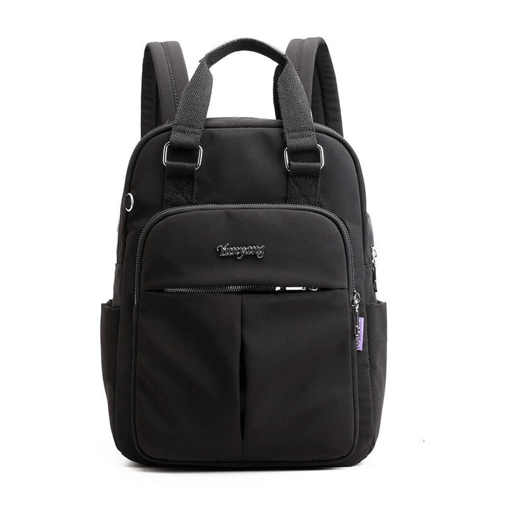 Premium water-resistant fabric of an anti-theft backpack, combining durability with a modern aesthetic.