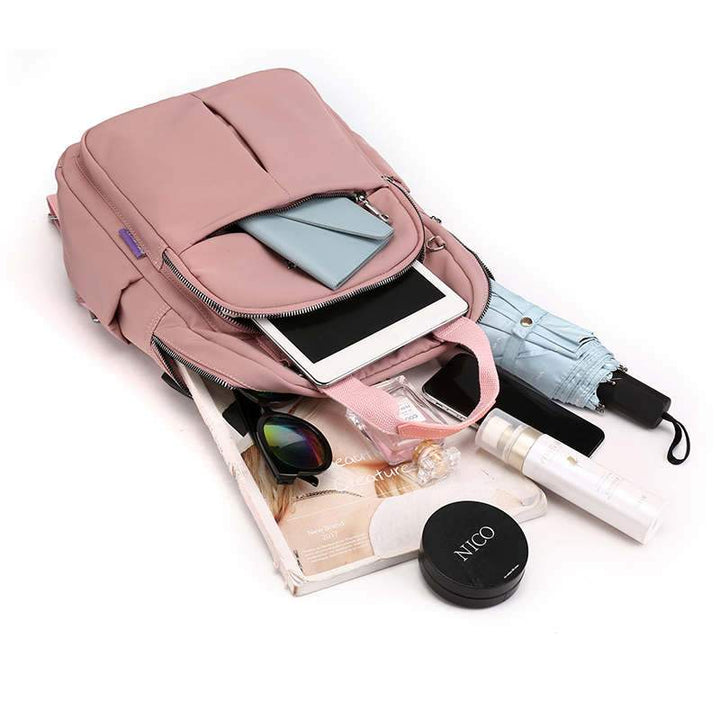 Integrated USB charging port on a water-resistant anti-theft backpack, keeping devices powered on-the-go.