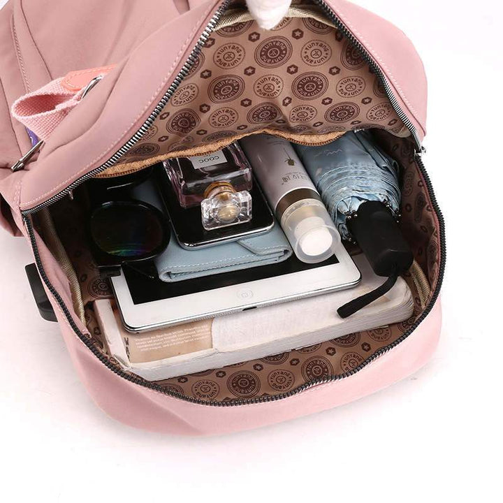 Organized main compartment of an anti-theft backpack, designed for laptops, books & travel essentials.