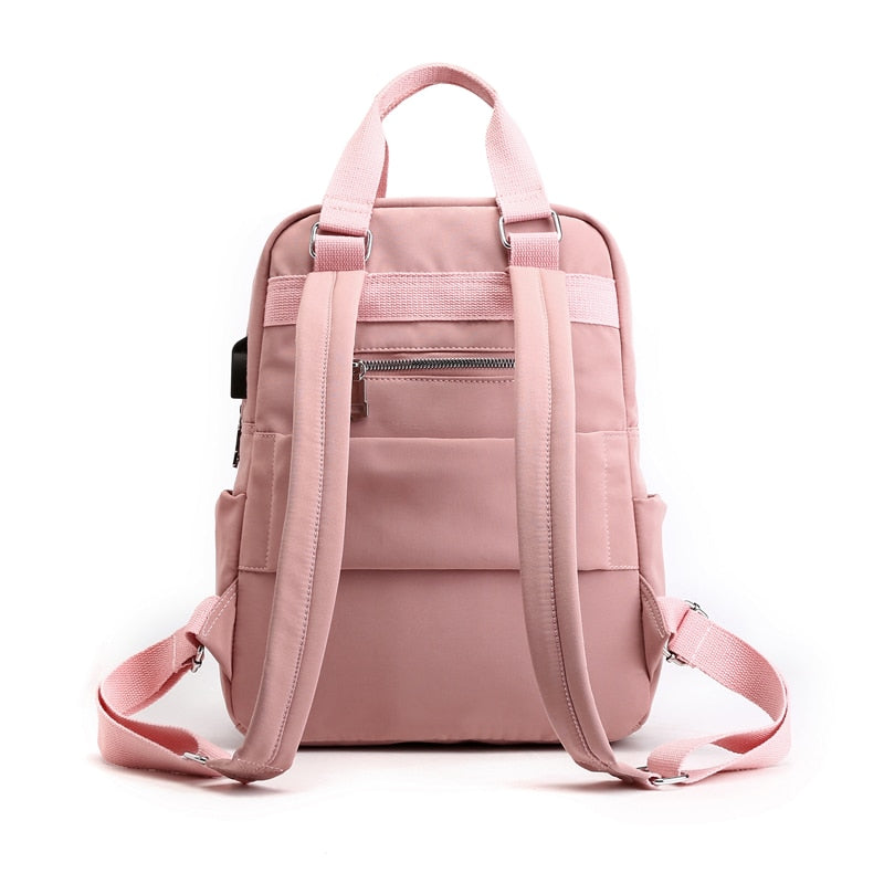 Multi-compartment anti-theft backpack interior, showing secure pockets for passport, phone & valuables.