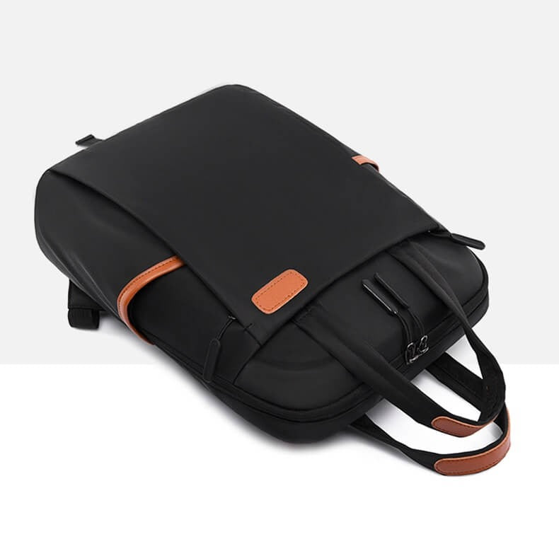 Stylish unisex anti-theft backpack, water-resistant Oxford material for secure travel & daily use.