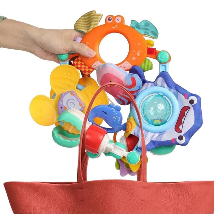 Safe unisex baby musical arch toy with engaging rattles & teethers, perfect for sensory development in strollers & car seats.