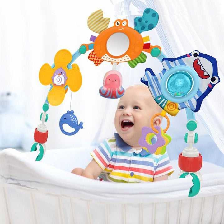 Colorful baby musical stroller arch toy with engaging rattles & soft teethers, suitable for infant car seats & bassinets.