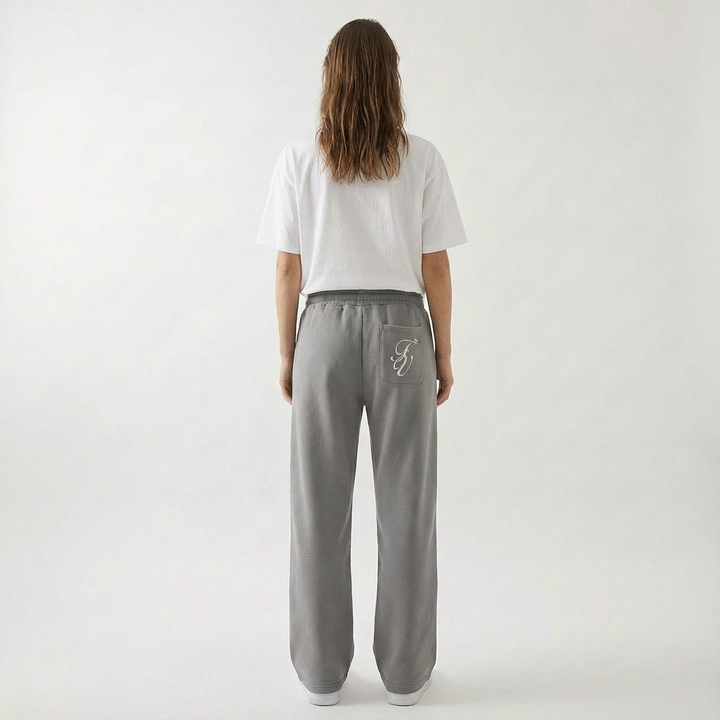 Soft cotton blend unisex baggy joggers, highlighting elastic waistband & deep side pockets. Perfect loungewear & athleisure.