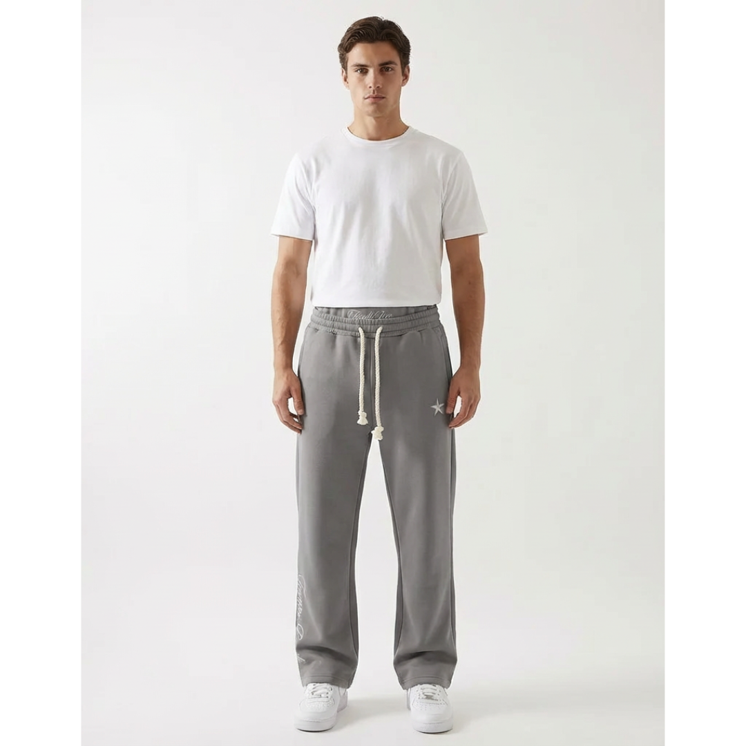 Model wearing grey unisex baggy joggers, showcasing relaxed fit, athleisure style & freedom of movement. Casual joggers.