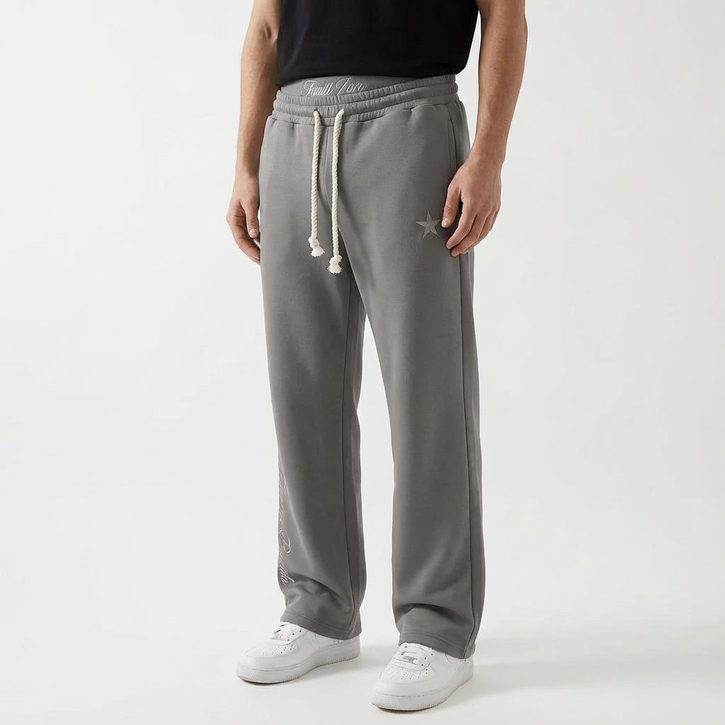 Person relaxing in comfortable unisex baggy joggers, emphasizing leisure pants, ultimate comfort & everyday style.